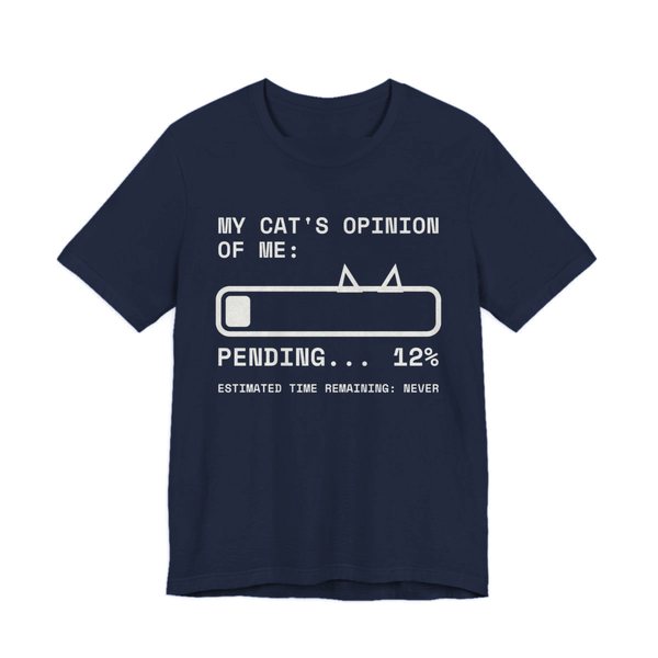 Navy t-shirt printed in off-white ink with “My Cat's Opinion of Me:” above a loading bar with cat ears, stuck at “Pending... 12%”, with “Estimated time remaining: never”
