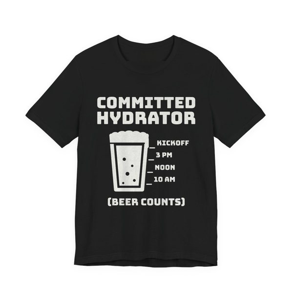Black t-shirt printed in off-white ink with “Committed Hydrator” above a pint glass with fill lines marked 10 AM, Noon, 3 PM and Kickoff, and “(Beer Counts)”