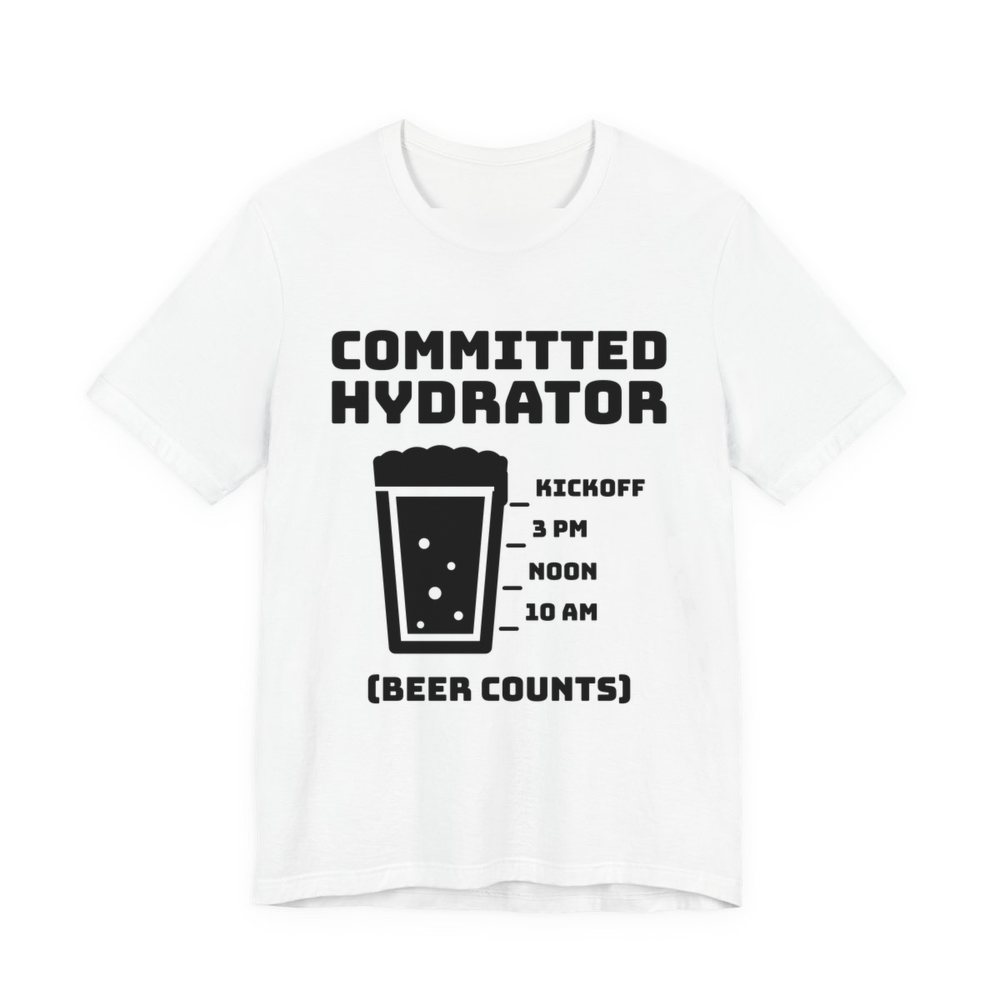White t-shirt printed in dark ink with “Committed Hydrator” above a pint glass with fill lines marked 10 AM, Noon, 3 PM and Kickoff, and “(Beer Counts)”