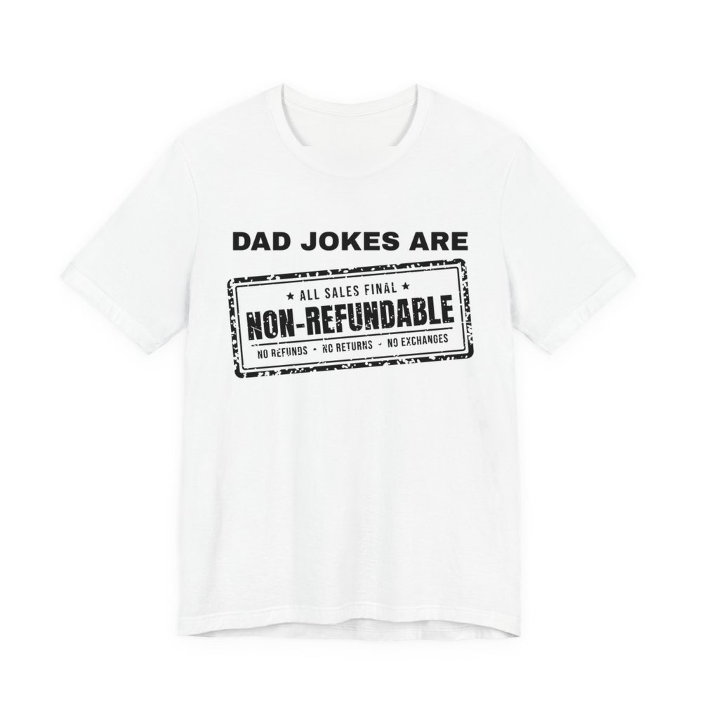White t-shirt printed in dark ink with the words “Dad Jokes Are” above a distressed rubber stamp reading “Non-Refundable”