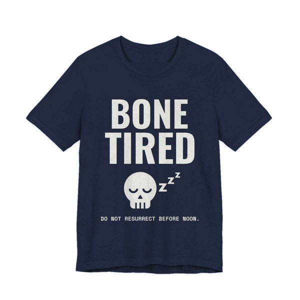 Navy t-shirt printed in off-white ink with “Bone Tired” above a sleeping skull with little z's, and “Do not resurrect before noon.”
