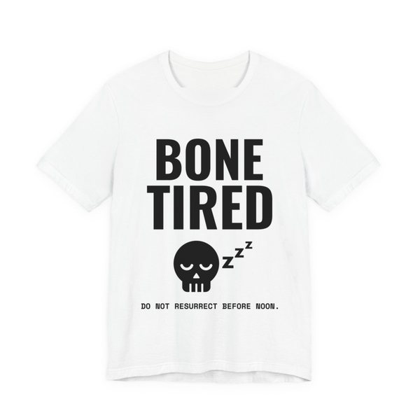 White t-shirt printed in dark ink with “Bone Tired” above a sleeping skull with little z's, and “Do not resurrect before noon.”