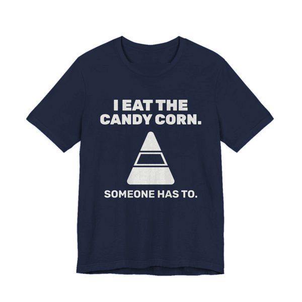 Navy t-shirt printed in off-white ink with “I Eat the Candy Corn.” above a big candy corn, with “Someone has to.”