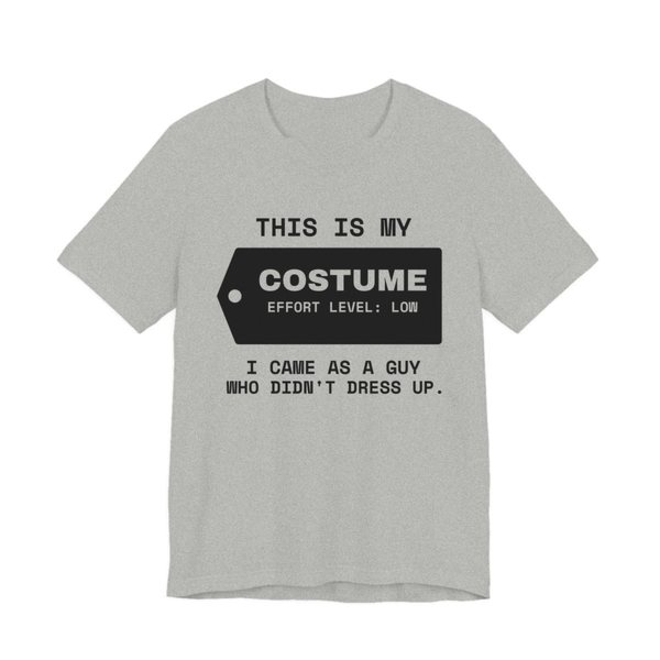 Athletic Heather t-shirt printed in dark ink with “This Is My” above a hang tag reading “Costume, effort level: low”, with “I came as a guy who didn't dress up.”