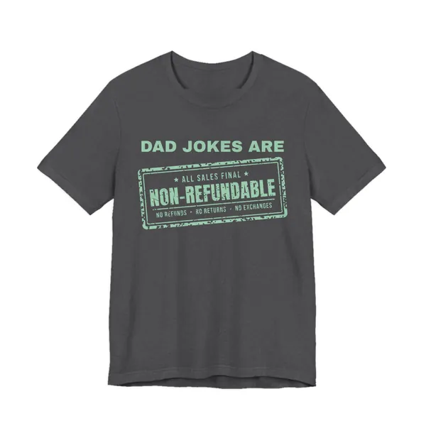 Dad Jokes Are Non-Refundable tee printed in mint green ink on a dark grey heather shirt