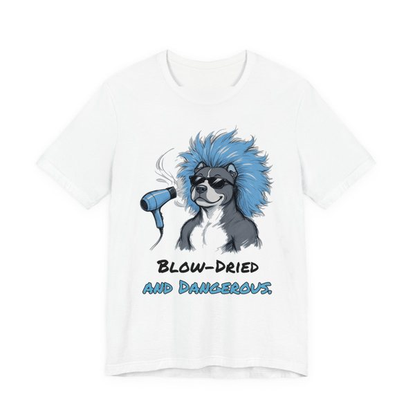 White t-shirt printed in full-color print with a full-color pencil drawing of a pit bull in sunglasses with huge blow-dried blue hair and a dryer and the words “Blow-Dried and Dangerous.”