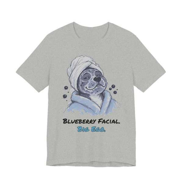 Athletic Heather t-shirt printed in full-color print with a full-color pencil drawing of a dog in a towel and bathrobe with blueberries around it and the words “Blueberry Facial. Big Ego.”