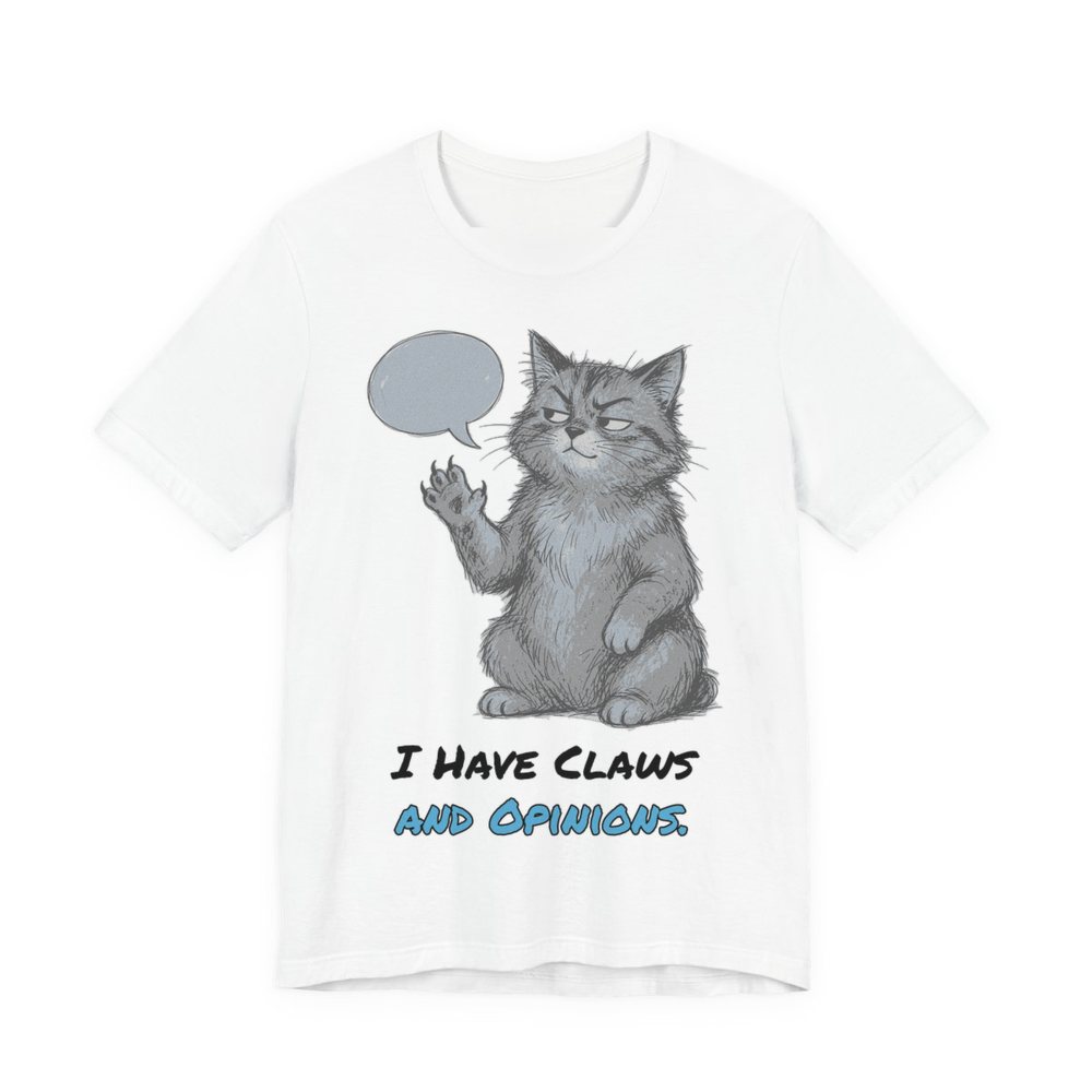 White t-shirt printed in full-color print with a full-color pencil drawing of a cat with a speech bubble, holding up one paw and the words “I Have Claws and Opinions.”