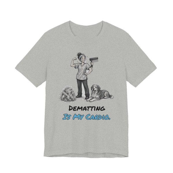 Athletic Heather t-shirt printed in full-color print with a full-color pencil drawing of a groomer flexing with a dryer next to a dog and a pile of fur and the words “Dematting Is My Cardio.”