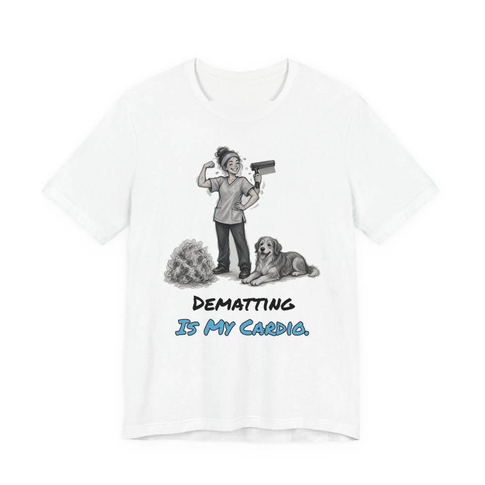 White t-shirt printed in full-color print with a full-color pencil drawing of a groomer flexing with a dryer next to a dog and a pile of fur and the words “Dematting Is My Cardio.”