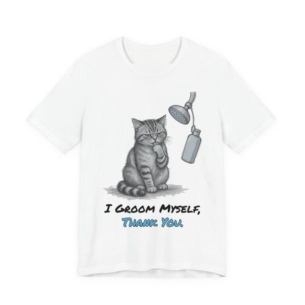 White t-shirt printed in full-color print with a full-color pencil drawing of a cat licking its paw next to a shower head and a shampoo bottle and the words “I Groom Myself, Thank You.”