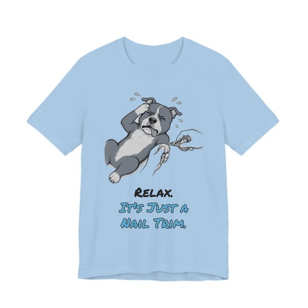 Baby Blue t-shirt printed in full-color print with a full-color pencil drawing of a pit bull dramatically flopping during a nail trim and the words “Relax. It's Just a Nail Trim.”