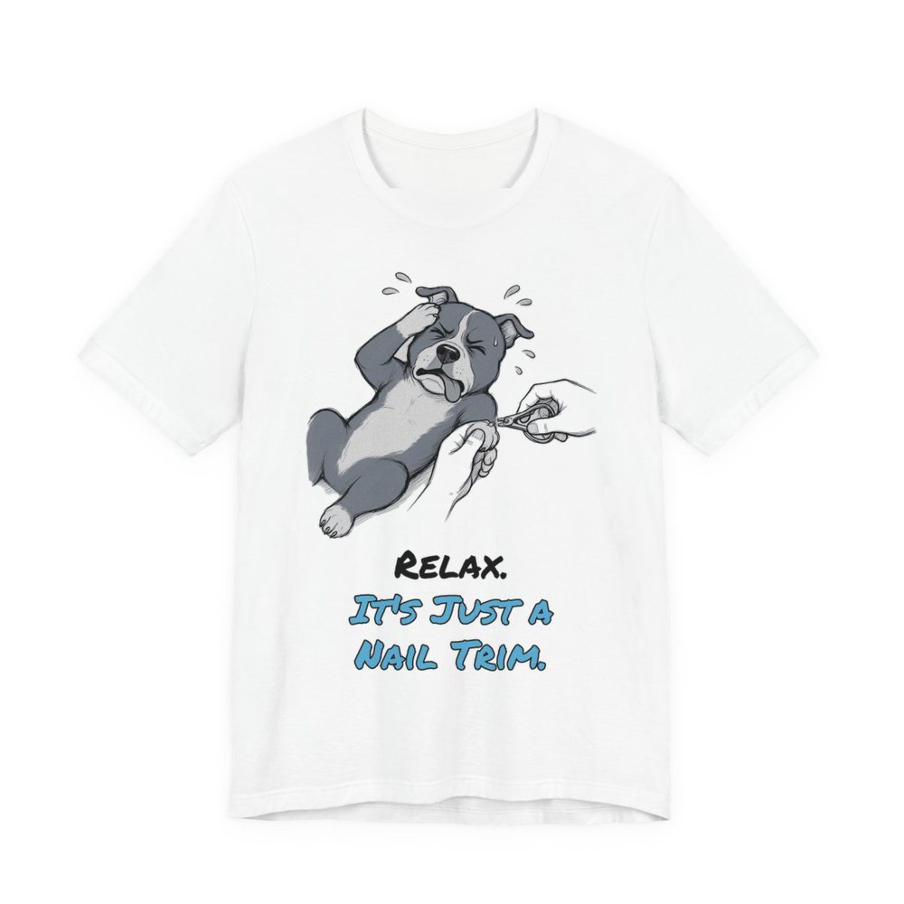 White t-shirt printed in full-color print with a full-color pencil drawing of a pit bull dramatically flopping during a nail trim and the words “Relax. It's Just a Nail Trim.”
