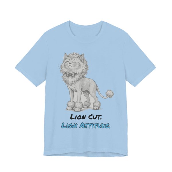 Baby Blue t-shirt printed in full-color print with a full-color pencil drawing of a cat with a lion cut, a bow tie and a pom-pom tail and the words “Lion Cut. Lion Attitude.”
