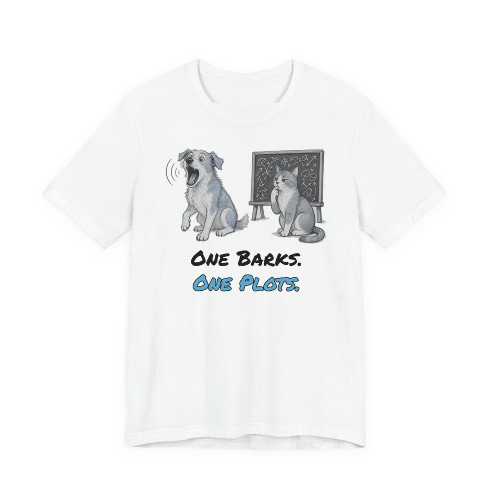 White t-shirt printed in full-color print with a full-color pencil drawing of a barking dog next to a cat in front of a chalkboard full of plans and the words “One Barks. One Plots.”