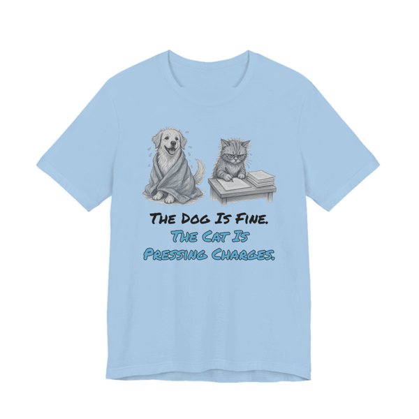 Baby Blue t-shirt printed in full-color print with a full-color pencil drawing of a dog wrapped in a towel next to a cat with paperwork and the words “The Dog Is Fine. The Cat Is Pressing Charges.”