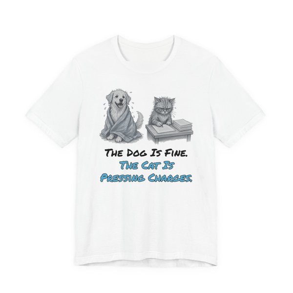 White t-shirt printed in full-color print with a full-color pencil drawing of a dog wrapped in a towel next to a cat with paperwork and the words “The Dog Is Fine. The Cat Is Pressing Charges.”
