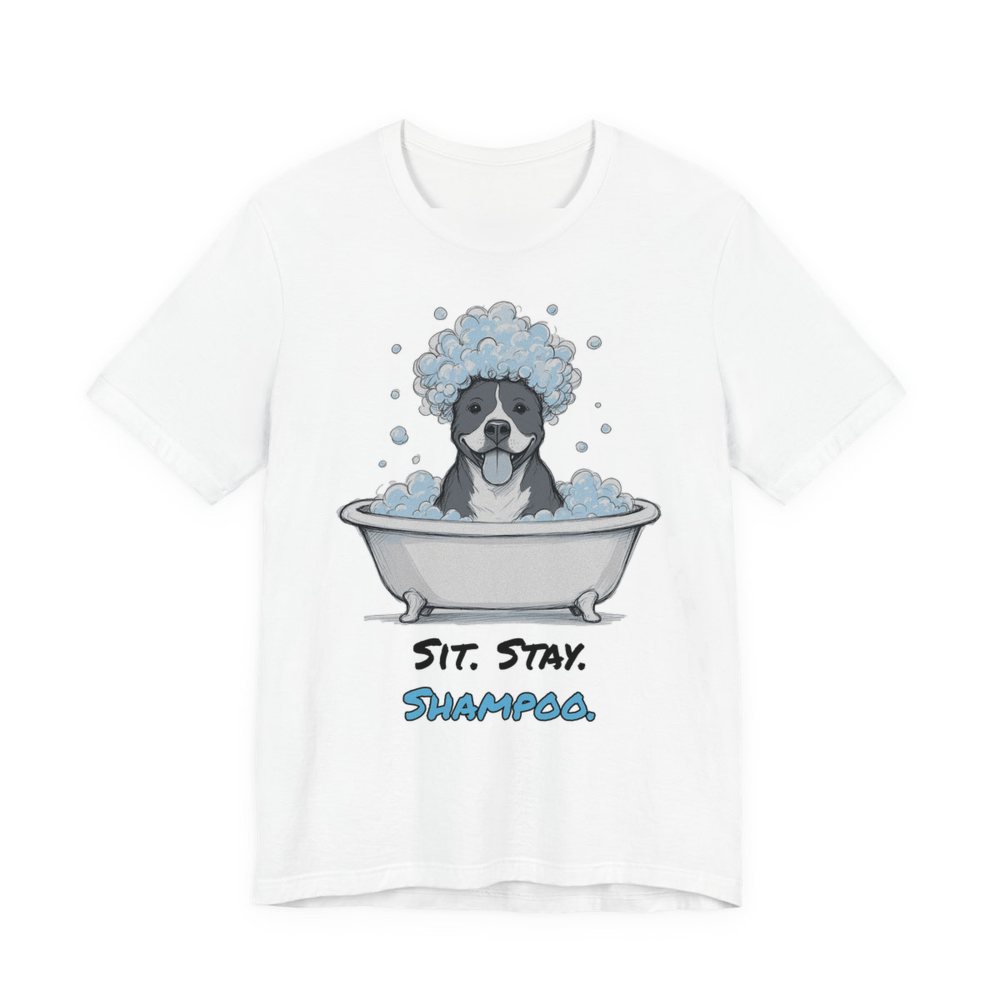 White t-shirt printed in full-color print with a full-color pencil drawing of a pit bull with a head full of bubbles in a clawfoot tub and the words “Sit. Stay. Shampoo.”