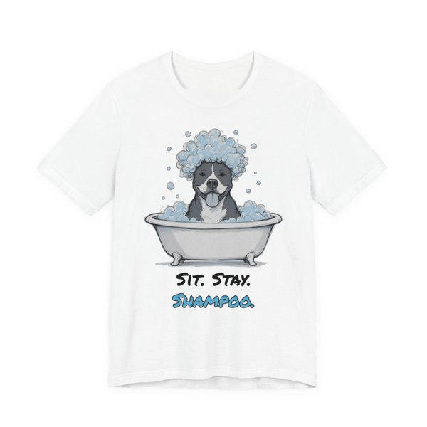 White t-shirt printed in full-color print with a full-color pencil drawing of a pit bull with a head full of bubbles in a clawfoot tub and the words “Sit. Stay. Shampoo.”