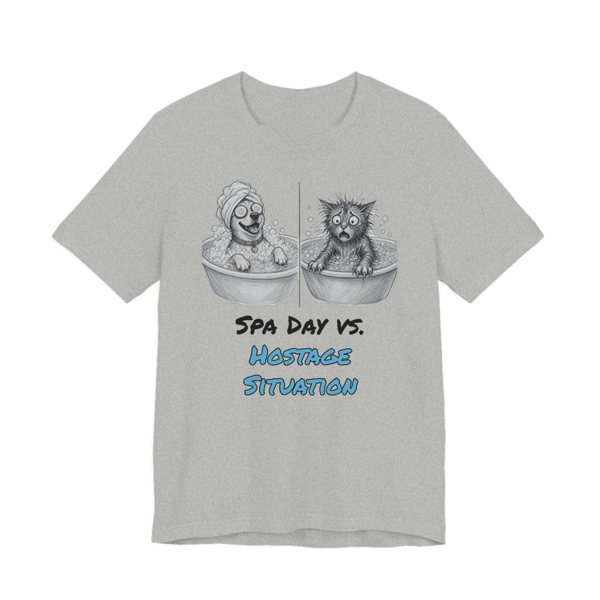 Athletic Heather t-shirt printed in full-color print with a full-color pencil drawing of a happy dog in a bubble bath next to a frazzled wet cat and the words “Spa Day vs. Hostage Situation”