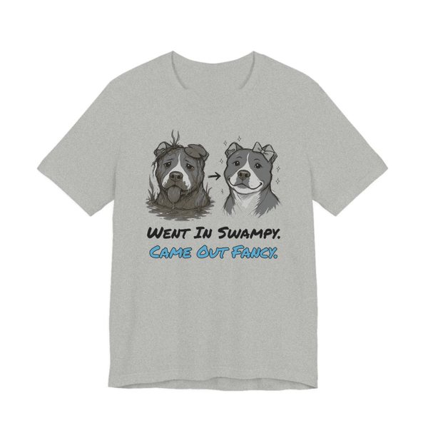 Athletic Heather t-shirt printed in full-color print with a full-color pencil drawing of a muddy pit bull next to the same pit bull freshly groomed and the words “Went In Swampy. Came Out Fancy.”