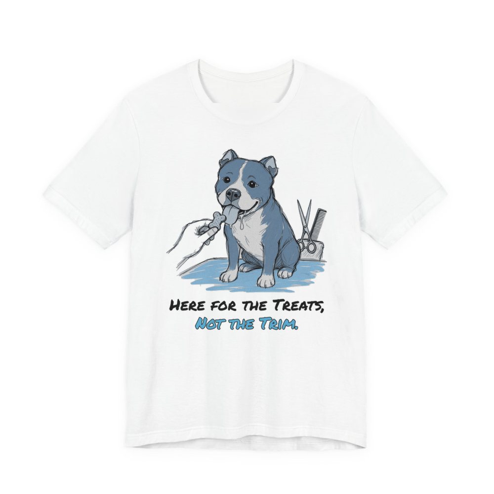 White t-shirt printed in full-color print with a full-color pencil drawing of a pit bull reaching for a treat next to grooming scissors and the words “Here for the Treats, Not the Trim.”