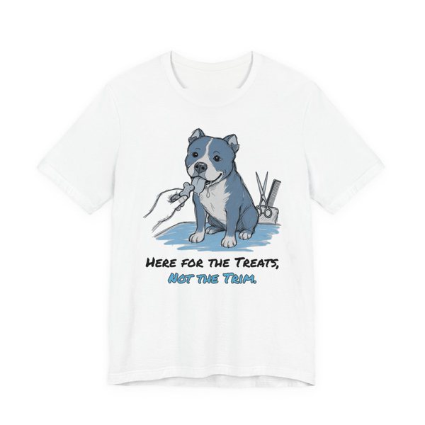 White t-shirt printed in full-color print with a full-color pencil drawing of a pit bull reaching for a treat next to grooming scissors and the words “Here for the Treats, Not the Trim.”