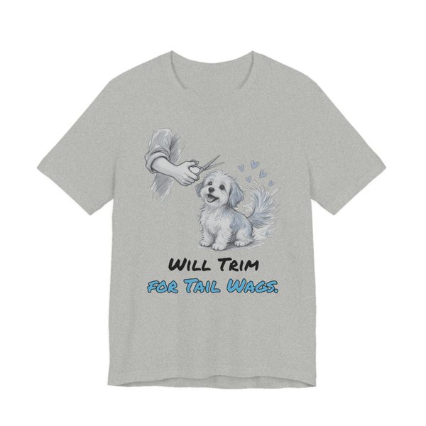 Athletic Heather t-shirt printed in full-color print with a full-color pencil drawing of a small fluffy dog getting a trim, with little hearts and the words “Will Trim for Tail Wags.”