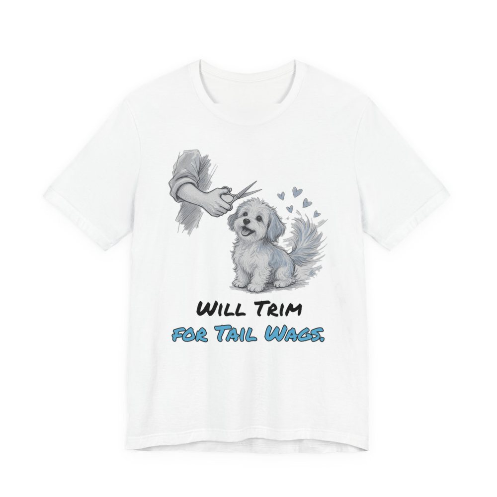 White t-shirt printed in full-color print with a full-color pencil drawing of a small fluffy dog getting a trim, with little hearts and the words “Will Trim for Tail Wags.”