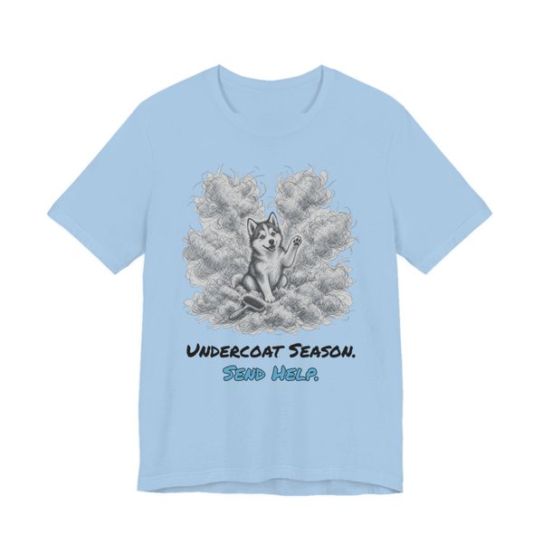 Baby Blue t-shirt printed in full-color print with a full-color pencil drawing of a husky surrounded by a cloud of shed undercoat and the words “Undercoat Season. Send Help.”