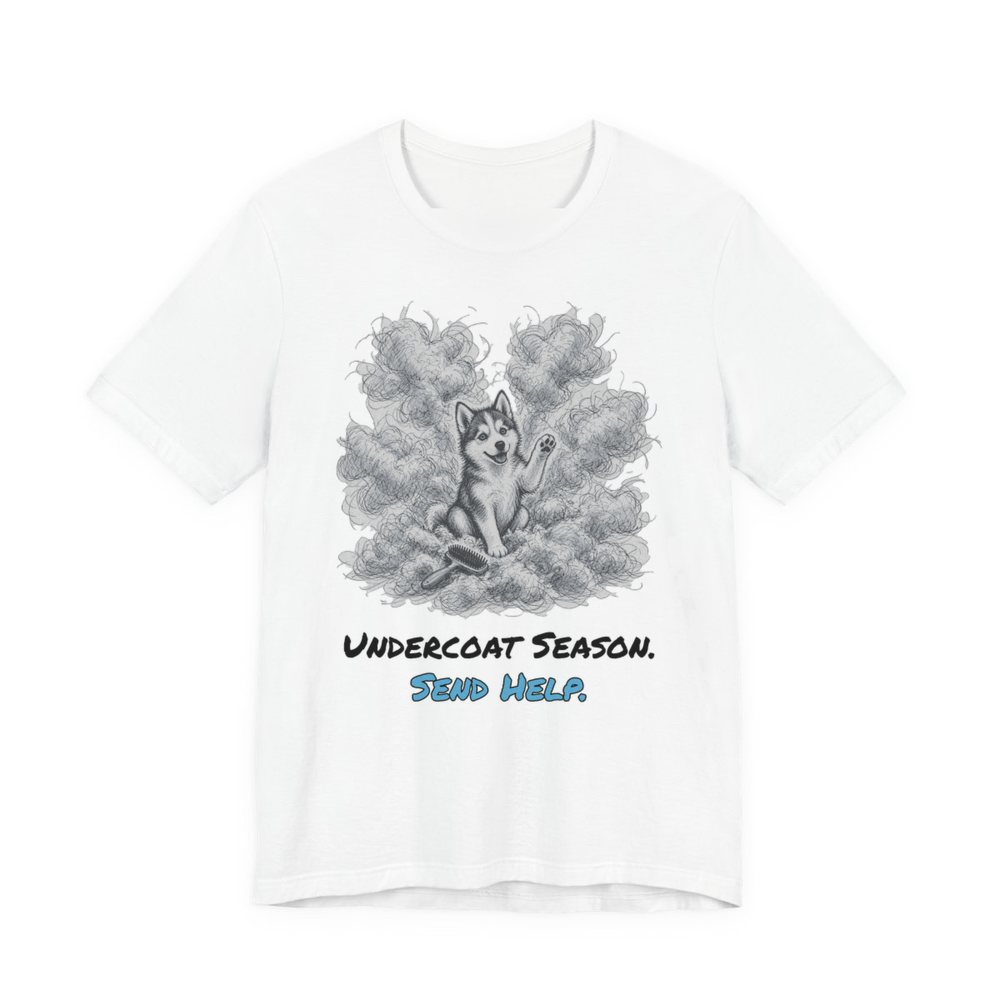 White t-shirt printed in full-color print with a full-color pencil drawing of a husky surrounded by a cloud of shed undercoat and the words “Undercoat Season. Send Help.”