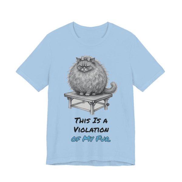Baby Blue t-shirt printed in full-color print with a full-color pencil drawing of a big fluffy cat glaring from a grooming table and the words “This Is a Violation of My Fur.”