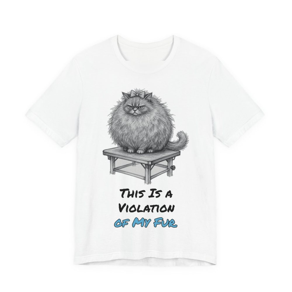 White t-shirt printed in full-color print with a full-color pencil drawing of a big fluffy cat glaring from a grooming table and the words “This Is a Violation of My Fur.”