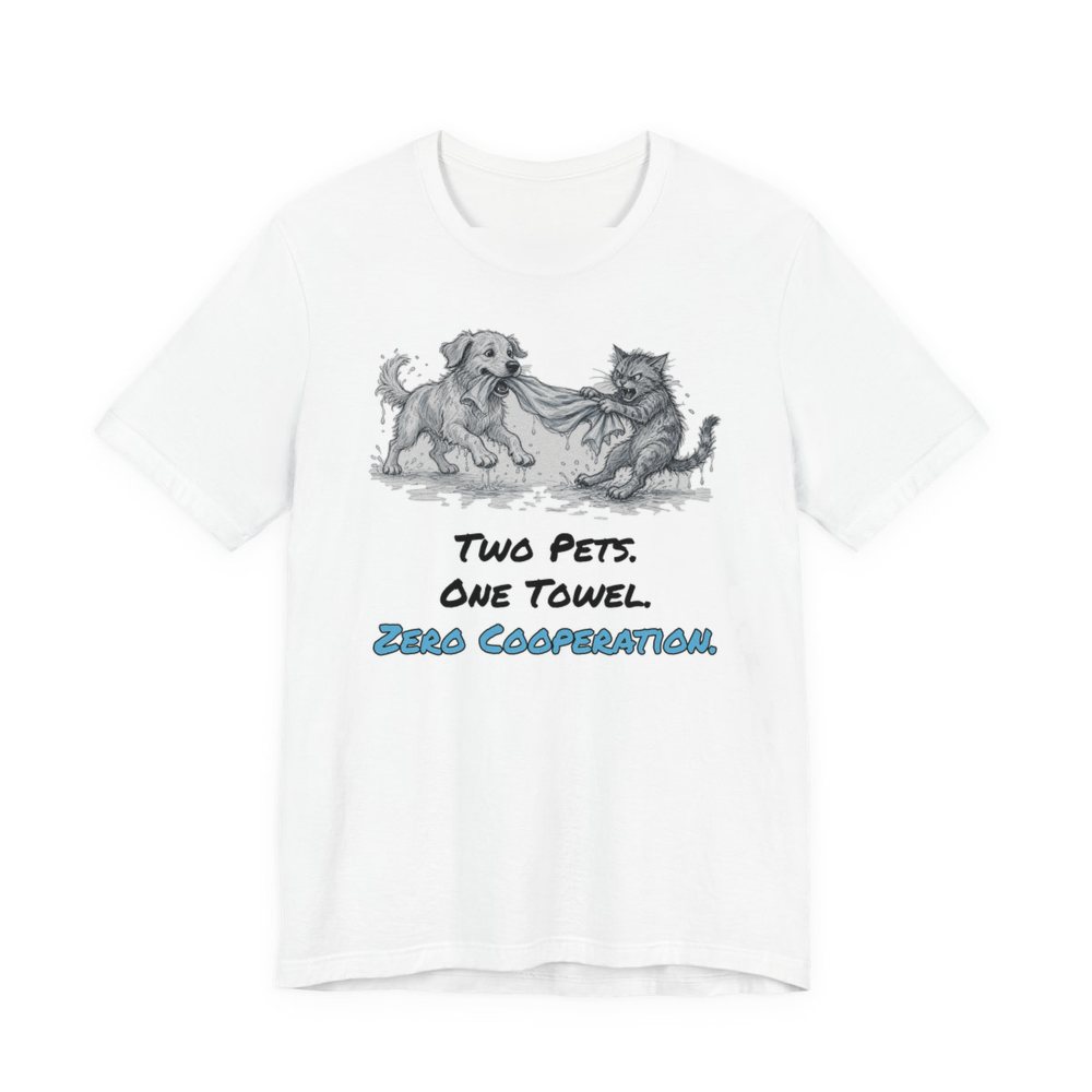White t-shirt printed in full-color print with a full-color pencil drawing of a dog and a cat tugging on the same towel and the words “Two Pets. One Towel. Zero Cooperation.”