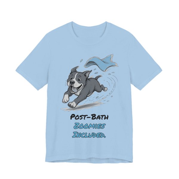 Baby Blue t-shirt printed in full-color print with a full-color pencil drawing of a pit bull sprinting away from a flying blue towel and the words “Post-Bath Zoomies Included.”