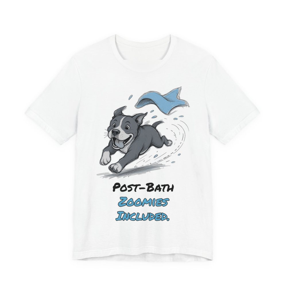 White t-shirt printed in full-color print with a full-color pencil drawing of a pit bull sprinting away from a flying blue towel and the words “Post-Bath Zoomies Included.”