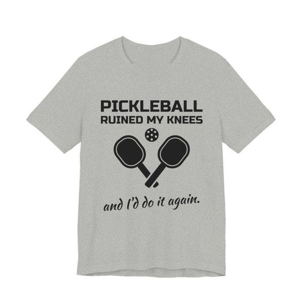 Athletic Heather t-shirt printed in dark ink with “Pickleball Ruined My Knees” above two crossed paddles and a ball, signed off with “and I'd do it again.”