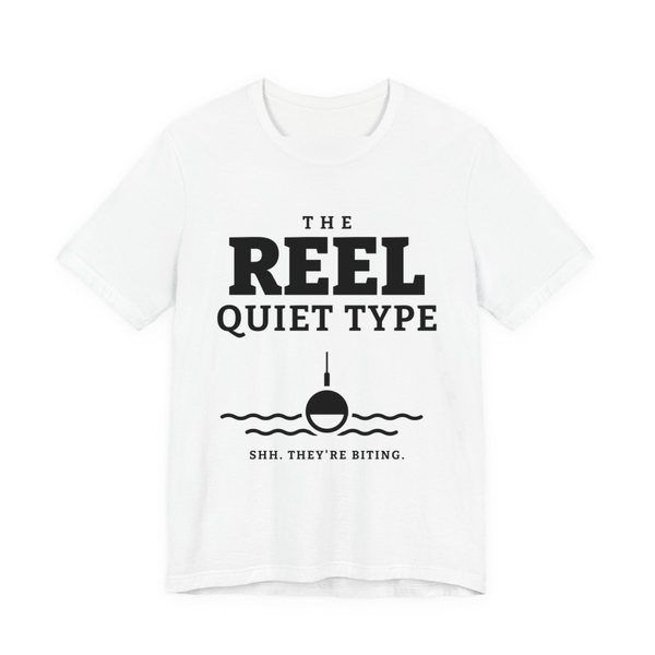 White t-shirt printed in dark ink with “The Reel Quiet Type” above a bobber floating on calm water, with “Shh. They're biting.”