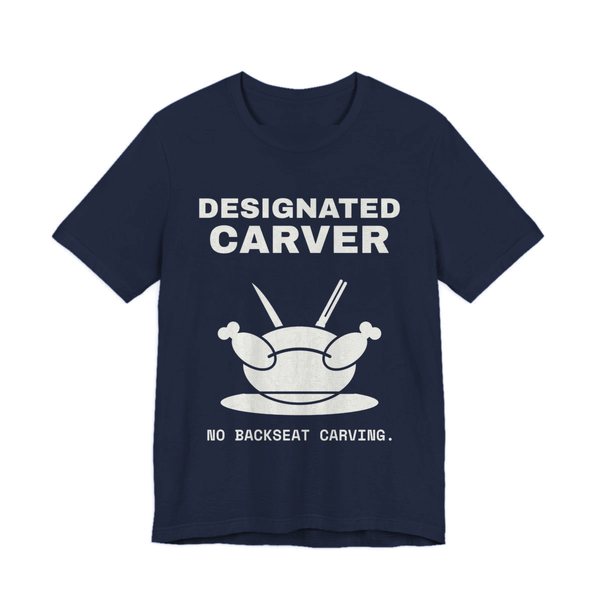 Navy t-shirt printed in off-white ink with a crossed carving knife and fork and the words “Designated Carver”