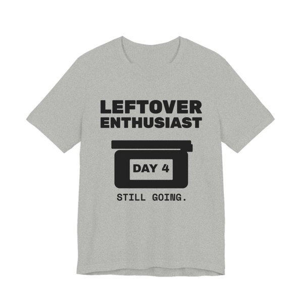 Athletic Heather t-shirt printed in dark ink with a takeout-style leftovers container and the words “Leftover Enthusiast”