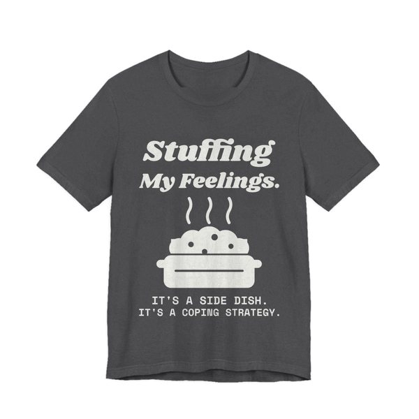 Dark Grey Heather t-shirt printed in off-white ink with the words “Stuffing My Feelings.”