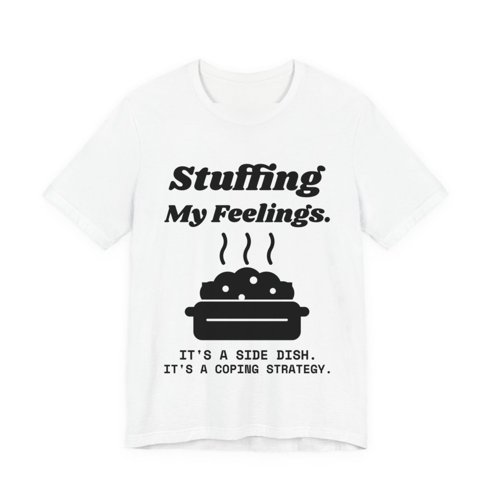 White t-shirt printed in dark ink with the words “Stuffing My Feelings.”