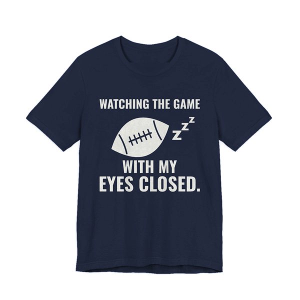 Navy t-shirt printed in off-white ink with the words “Watching the Game With My Eyes Closed.”