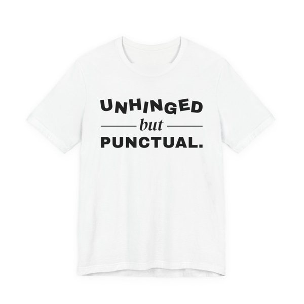 White t-shirt printed with “Unhinged” in wobbly capitals, a calm italic “but”, and “Punctual.” squared away underneath