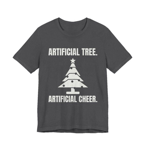 Dark Grey Heather t-shirt printed in off-white ink with a Christmas tree and the words “Artificial Tree. Artificial Cheer.”