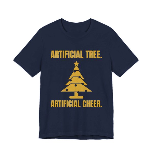 Navy t-shirt printed in gold ink with a Christmas tree and the words “Artificial Tree. Artificial Cheer.”