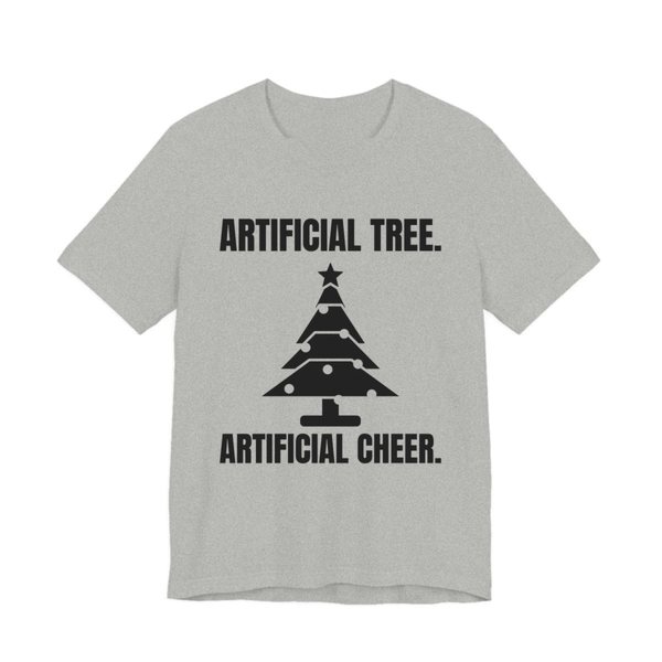 Athletic Heather t-shirt printed in dark ink with a Christmas tree and the words “Artificial Tree. Artificial Cheer.”