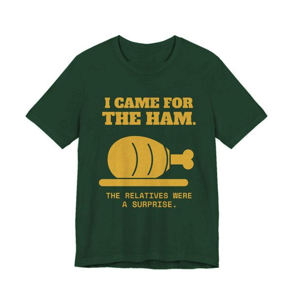 Forest t-shirt printed in gold ink with a holiday ham and the words “I Came for the Ham. The Relatives Were a Surprise.”