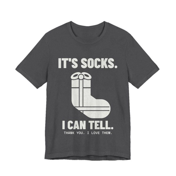 Dark Grey Heather t-shirt printed in off-white ink with a sock-shaped wrapped present and the words “It's Socks. I Can Tell. Thank you. I love them.”