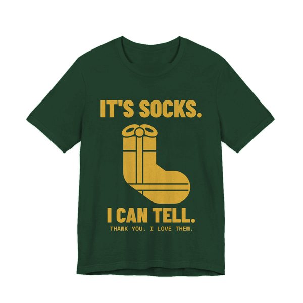 Forest t-shirt printed in gold ink with a sock-shaped wrapped present and the words “It's Socks. I Can Tell. Thank you. I love them.”